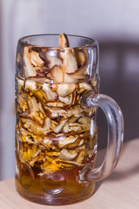 Close-up of beer glass on table