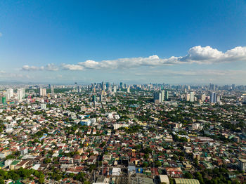 Aerial view of cityscape against sky