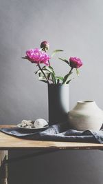 Close-up of pink flower vase on table