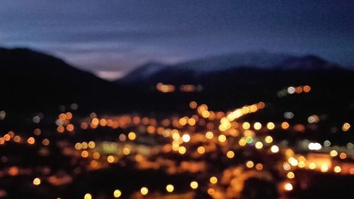 Defocused image of illuminated lights at night