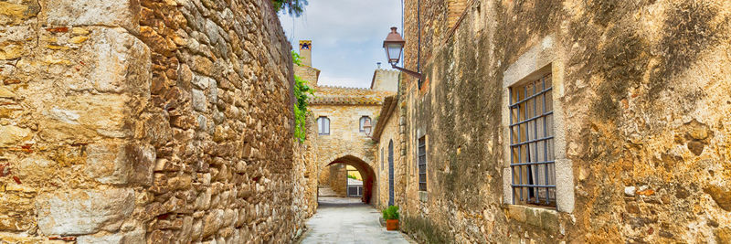 Alley amidst buildings in city