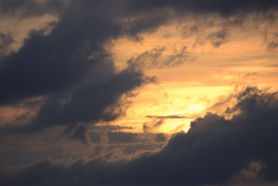 Low angle view of dramatic sky during sunset