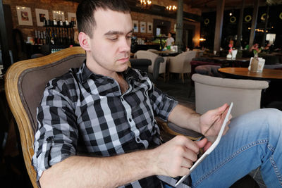 Young man using mobile phone