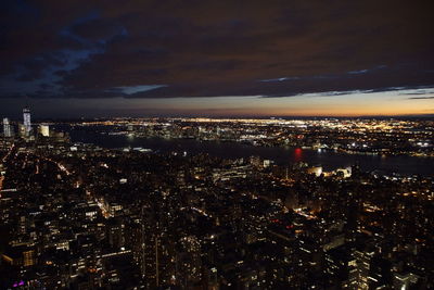 Aerial view of illuminated cityscape at night