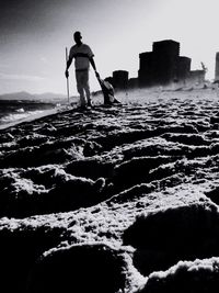 Silhouette of woman standing on beach