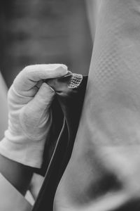 Close-up of hand holding textile