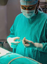 Midsection of man wearing mask