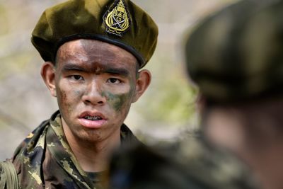 Close-up portrait of young man wearing mask