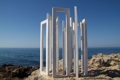 Scenic view of sea against clear blue sky