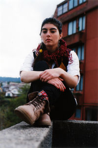 Young woman sitting on steps