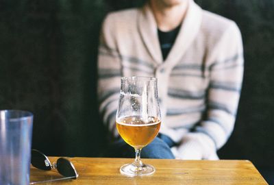 Close-up of beer glass on table