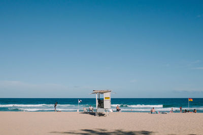 Scenic view of beach against clear sky