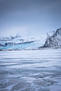 Scenic view of sea against sky during winter