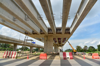 Low angle view of bridge against sky in city