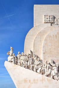 Statue of historic building against blue sky