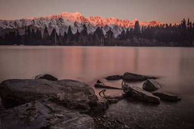 Scenic view of lake at sunset