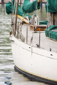 Low section of people on boat moored at harbor