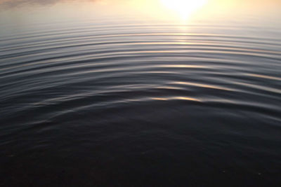 Full frame shot of rippled water at sunset