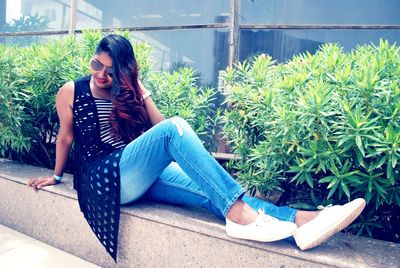 Young woman sitting outdoors