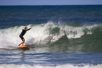 Man surfing in sea