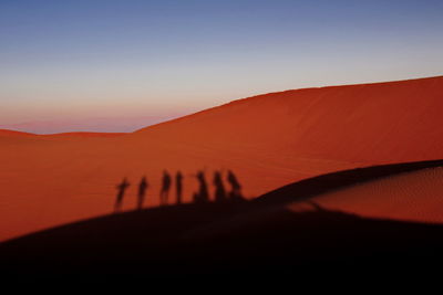 Scenic view of silhouette mountains against sky during sunset