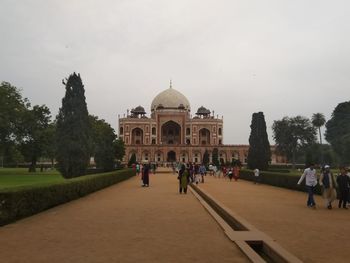 Group of people in front of historical building