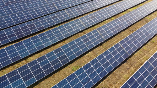 Aerial drone view flight over solar power station panels. aerial top view of solar farm. 