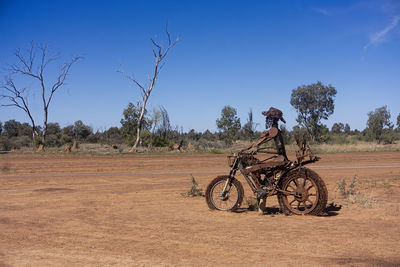 Bicycle on field against sky