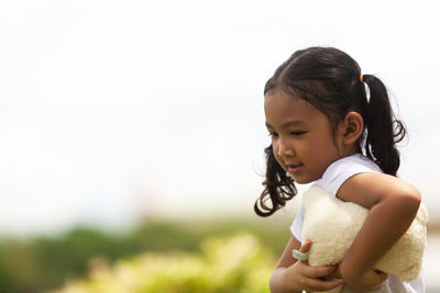 Side view of a girl looking down