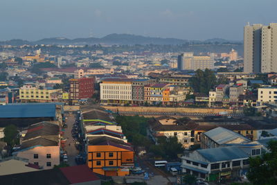 High angle view of buildings in town against sky