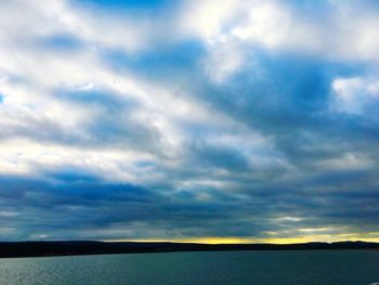 Scenic view of dramatic sky over sea