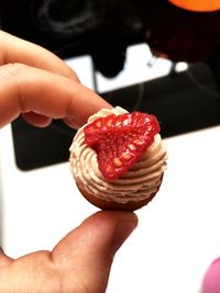 Midsection of person holding ice cream