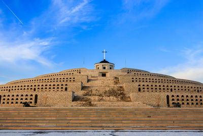 Low angle view of building against blue sky