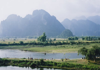 Scenic view of landscape and mountains against sky