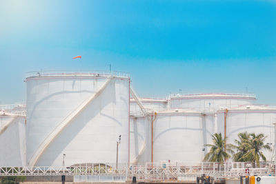 View of factory against blue sky