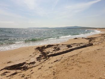 Scenic view of beach against sky