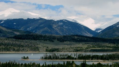 Scenic view of lake against cloudy sky