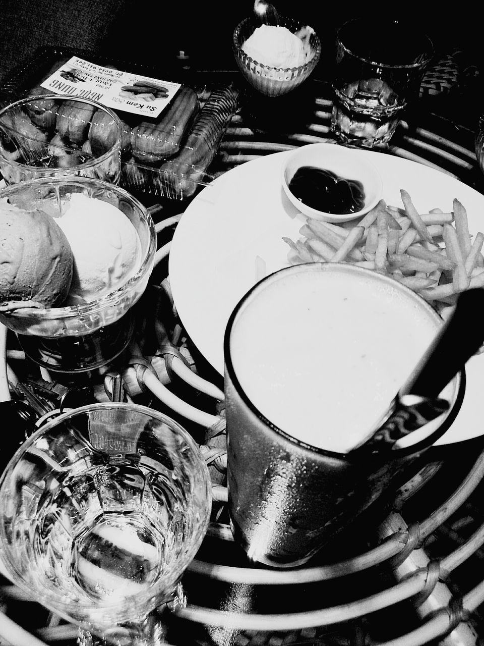 food and drink, indoors, no people, still life, close-up, high angle view, large group of objects, glass, household equipment, food, bowl, table, kitchen utensil, container, choice, drink, drinking glass, variation, plate, refreshment, crockery, silver colored