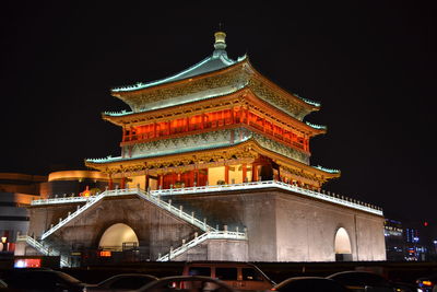 Low angle view of illuminated building at night