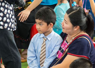 High angle view of mother and son at farewell