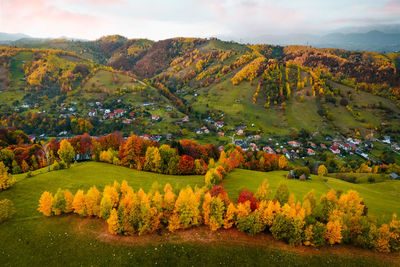 Aerial view of mountain and village in autumn