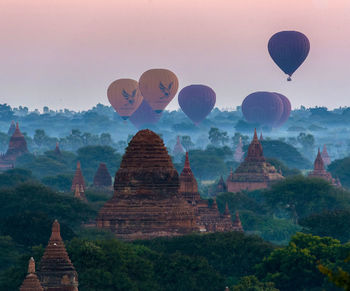 View of hot air balloons in temple against sky