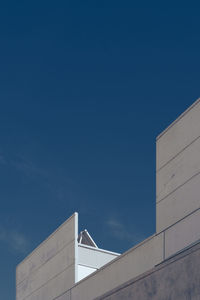 Low angle view of building against clear blue sky