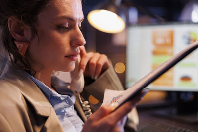 Close-up of woman using mobile phone