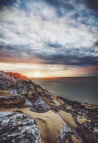 Scenic view of sea against sky at sunset