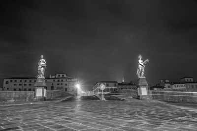 Fountain in city at night