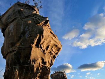 Low angle view of statue against sky