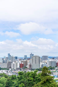 Buildings in city against sky