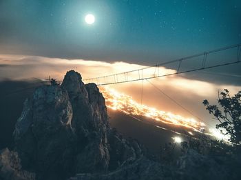 Scenic view of rocks against sky during sunset