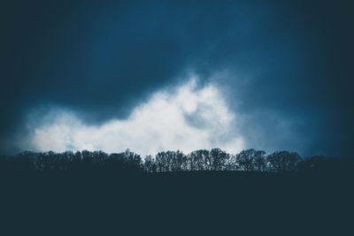 Scenic view of silhouette trees against sky